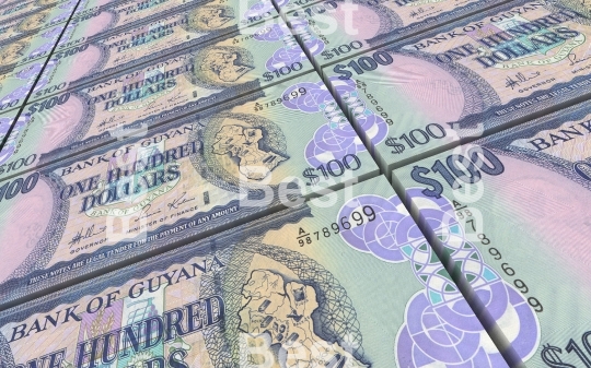 Guyanese dollars bills stacks background