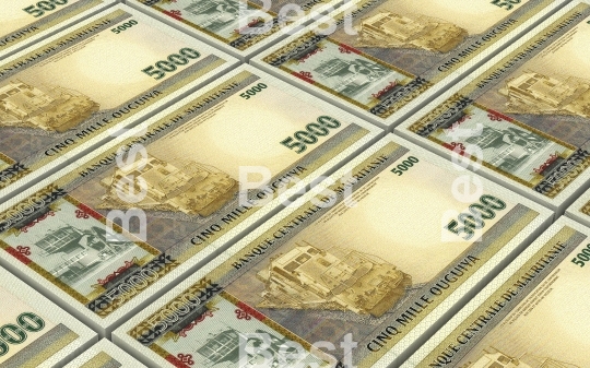 Mauritanian ouguiya bills stacks background